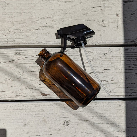 16 fl oz Amber Boston Round Bottle with Black Spray Nozzle